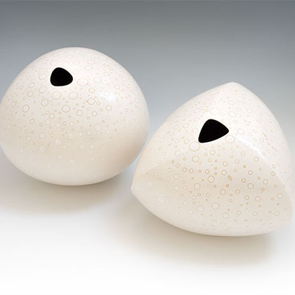 unglazed burnished earthenware, soluble metal salts, interior under-glaze of waterworn stones