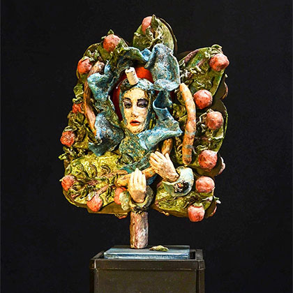 assemblage: clay with Ediphone base, steel and found objects sculpture of a lady surrounded by apples