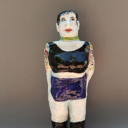 ceramic, hand-built with slabs, low-fire clay and glaze sculpture of a woman with short hair, wearing a black crop top and blue shorts, with tattoos on her arm