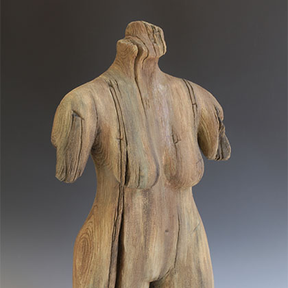 carve wooden sculpture of a female torso