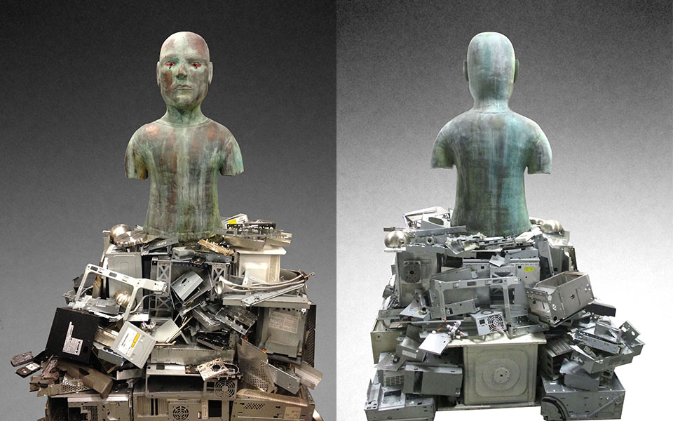 ceramic and coil-built sculpture of a person rising from a pile of disassembled computer pieces