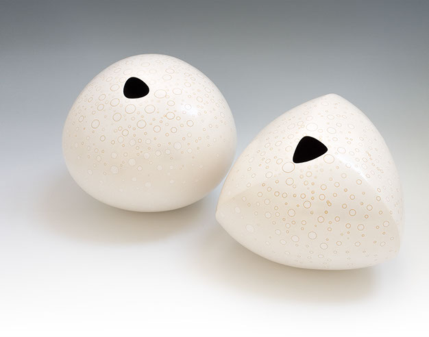 unglazed burnished earthenware, soluble metal salts, interior under-glaze of waterworn stones