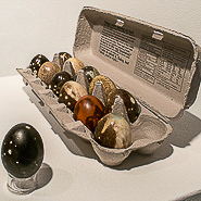 Cosmic Eggs, 2017 porcelain (slip cast, Obvara low fire), cardboard carton 2.5 x 12 x 8.5” Courtesy of the artist