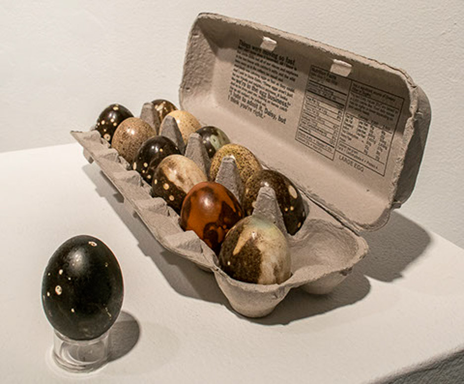 Cosmic Eggs, 2017 porcelain (slip cast, Obvara low fire), cardboard carton 2.5 x 12 x 8.5” Courtesy of the artist