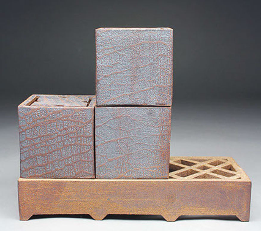 Three Boxes with Lattice Stand, 2016 stoneware rust engobe, interior Chun clear glaze 7.5 x 14.5 x 5.25” Courtesy of the artist