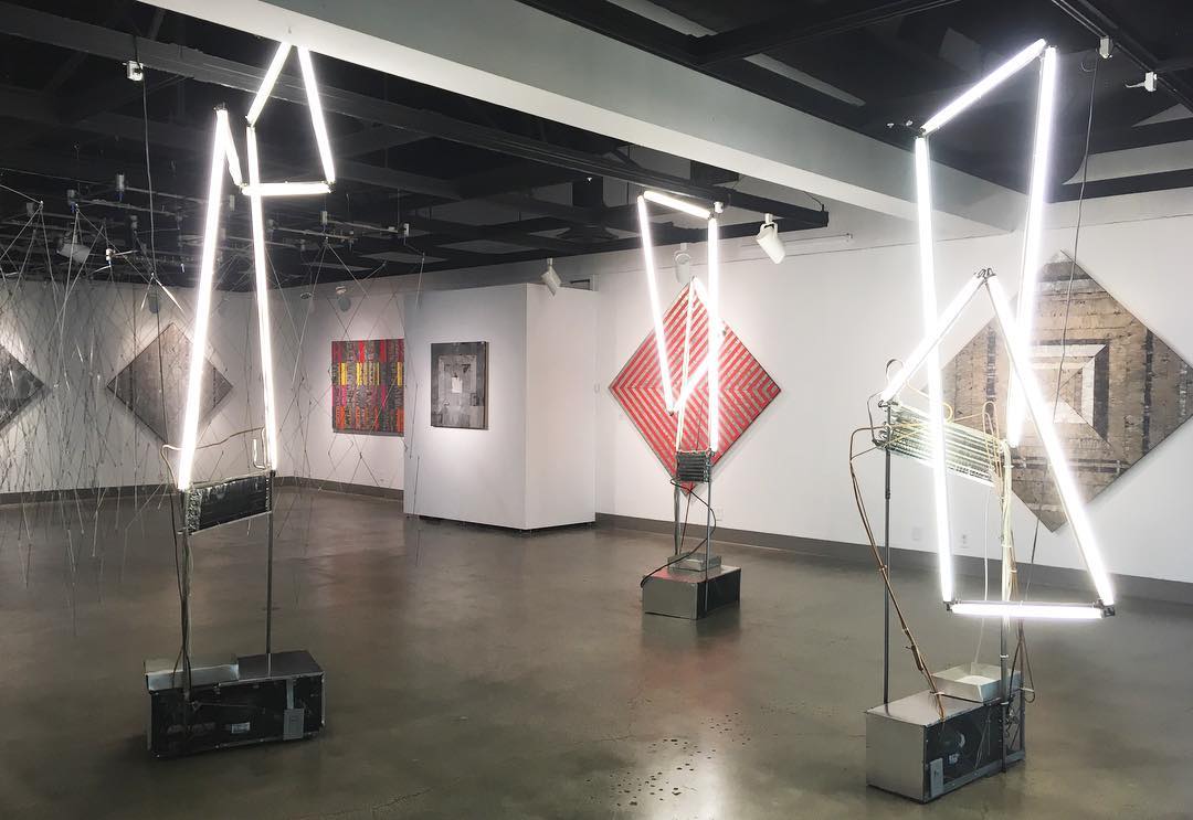 Back of the gallery, Exhibition: David Jang: Systems of Production, Feb 22 - Apr 26, 2018, Curator: Michele Cairella Fillmore, W. Keith & Janet Kellogg Art Gallery, Cal Poly Pomona. [Gallery Shot showing 3 of David Jang's Most dynamic works]