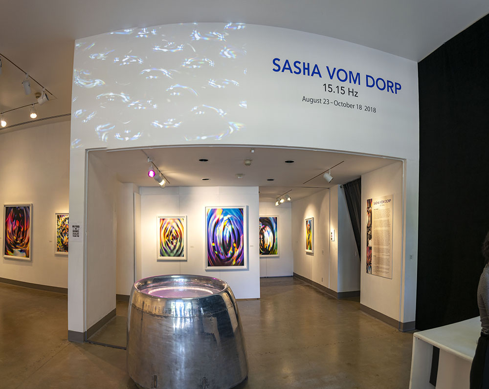 Title wall entrance view of the gallery, Exhibition: Sasha vom Dorp: 15.15 Hz, Aug. 23 - Oct. 18, 2018, Curator: Michele Cairella Fillmore, W. Keith & Janet Kellogg Art Gallery, Cal Poly Pomona. [Sasha vom Dorp: 15.15 Hz exhibition entrance (Photo Credit: William W. Gunn)]
