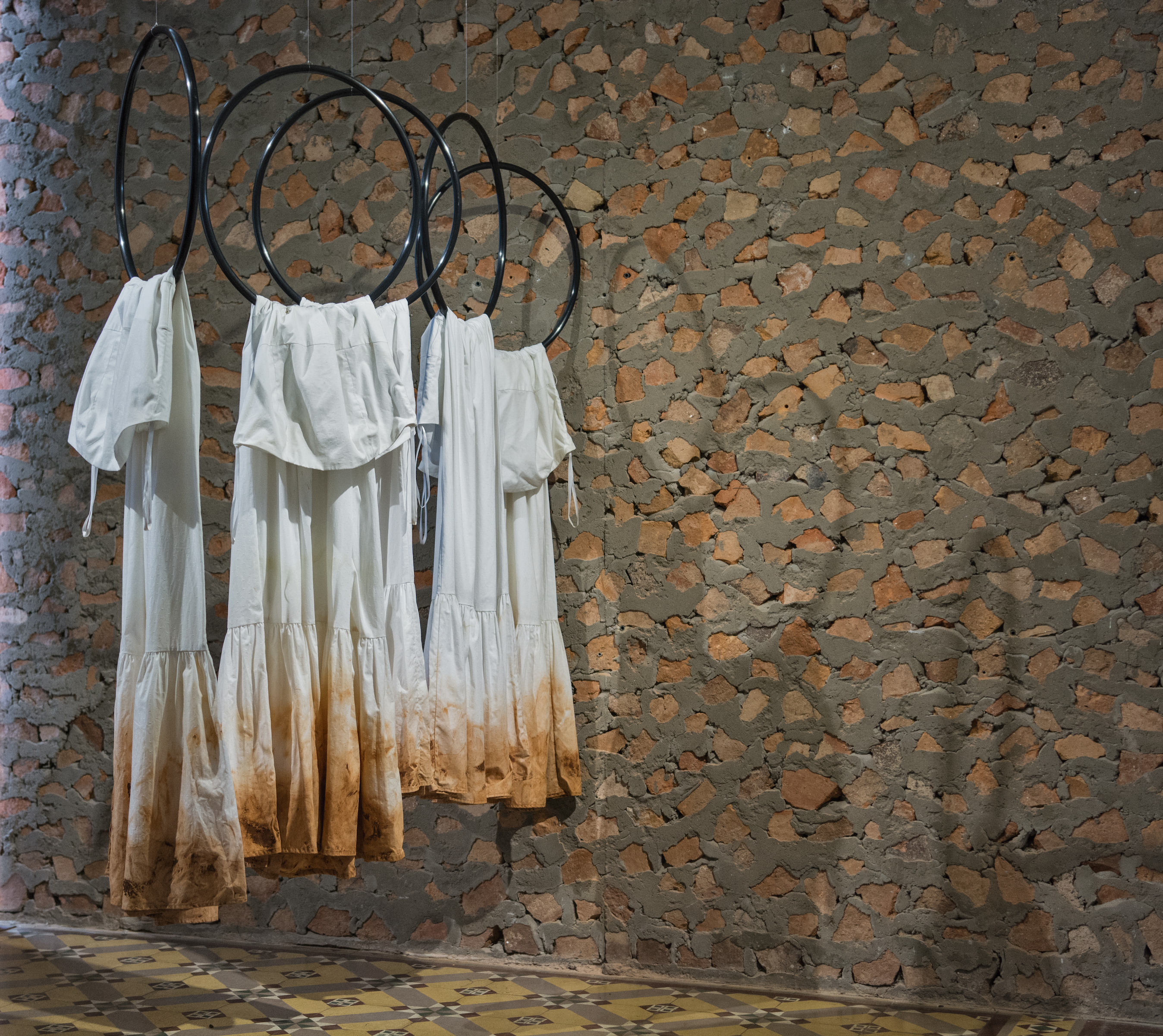 Claudia Casarino  Ellas 5, 2019  Cotton dresses with red earth  Variable dimensions Edition of 1  Courtesy of RoFa Projects Gallery 