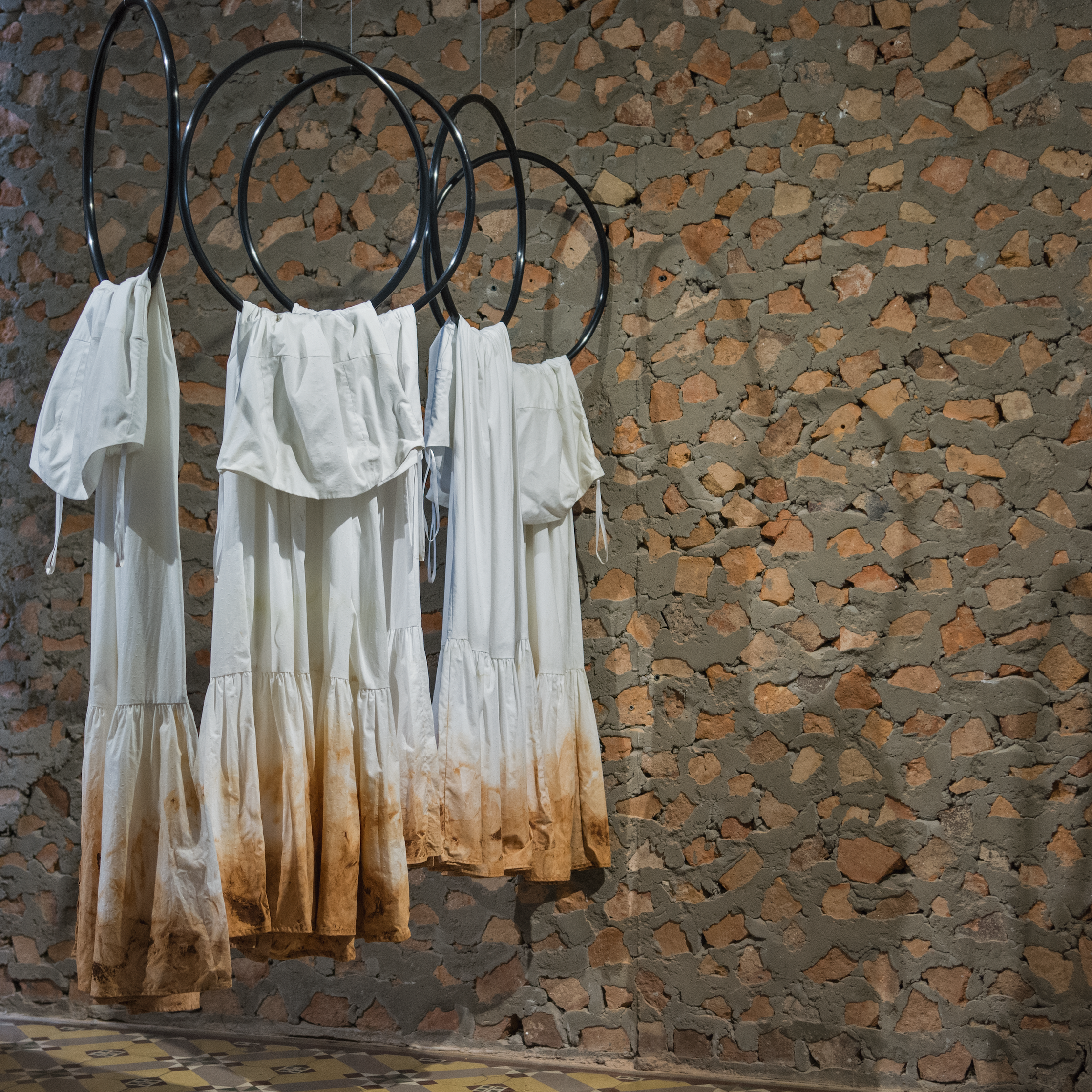 Claudia Casarino  Ellas 5, 2019  Cotton dresses with red earth  Variable dimensions Edition of 1  Courtesy of RoFa Projects Gallery 