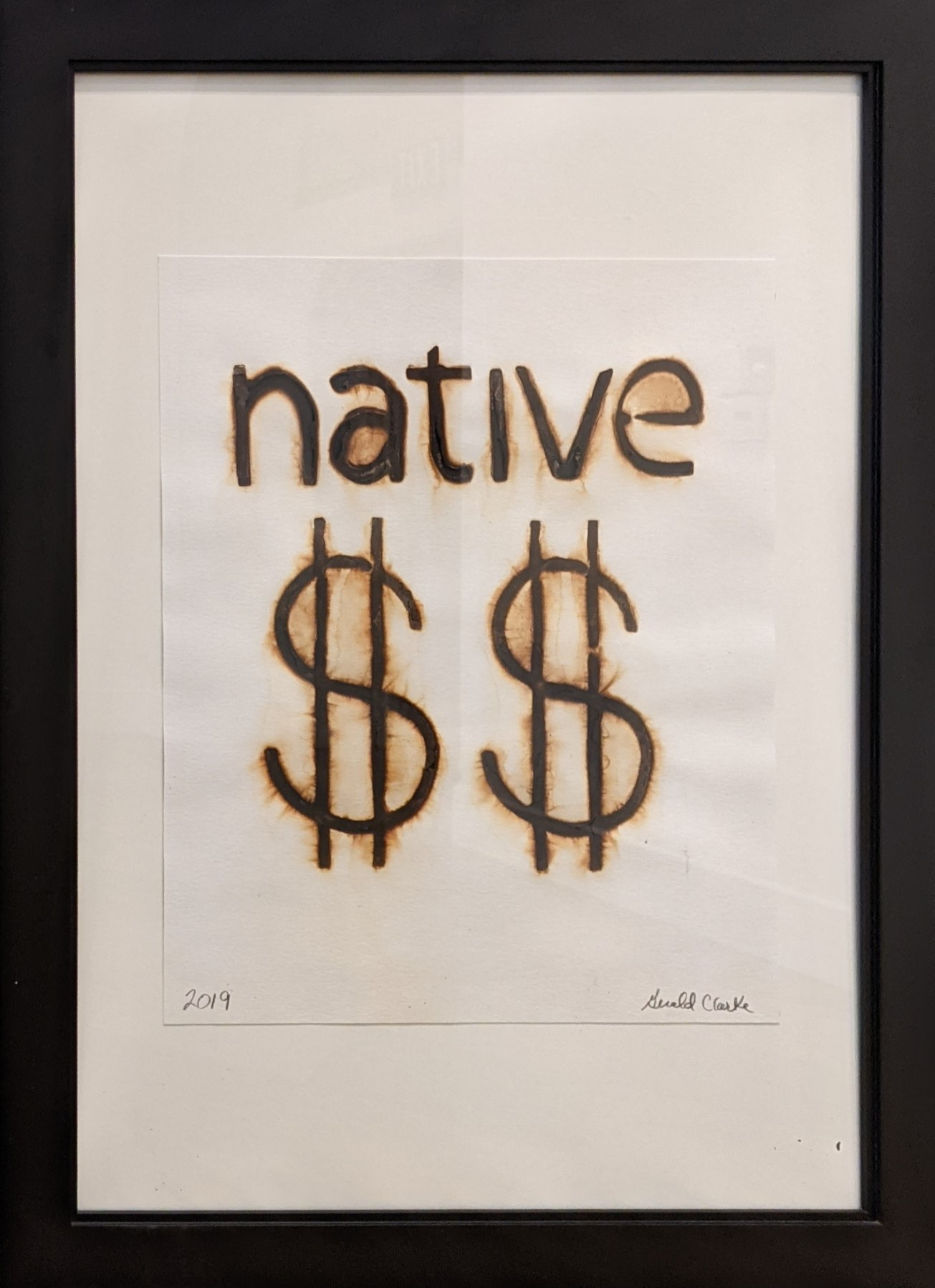 Gerald Clarke Native $$, from the Branded Series, 2019 Charred watercolor paper 13”H x 12 W”