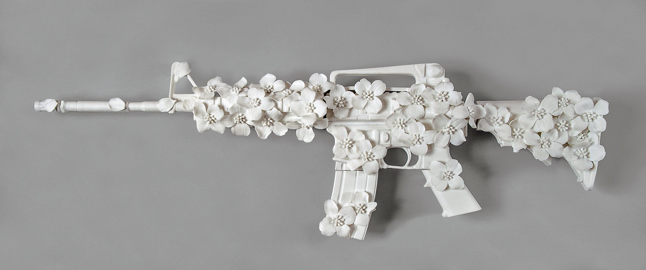 Keiko Fukazawa   AKA AR-15-0416200732 (Blacksburg, Virginia),  from the Peacemaker series, 2018  Porcelain, Plexiglass Case  39”W x 15”D x 6”H 