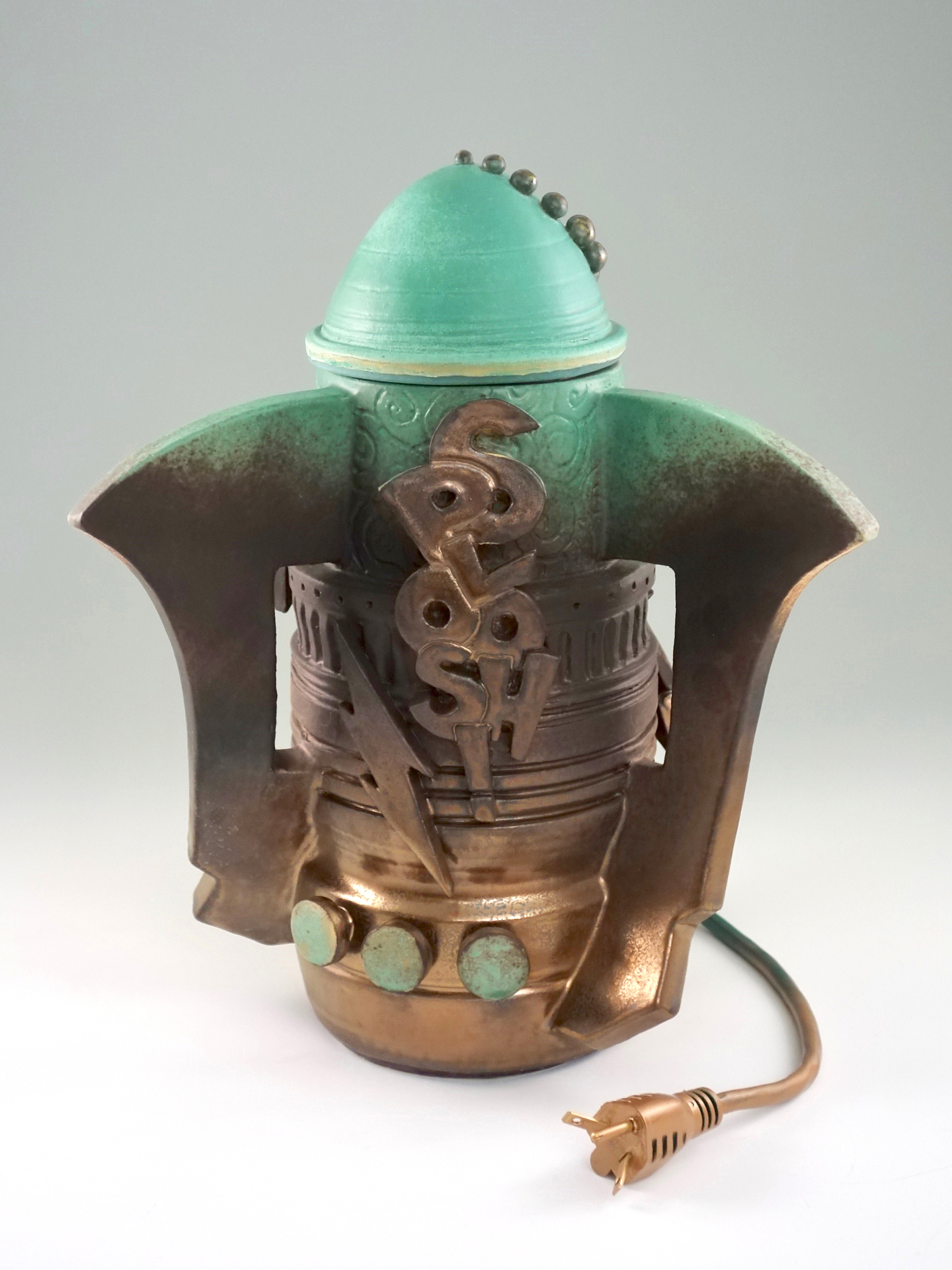 retro futuristic style bronze and mint colored jar that has a wall plug and the word "SPLOOSH" on the front with three mint colored buttons and a lightening strike.