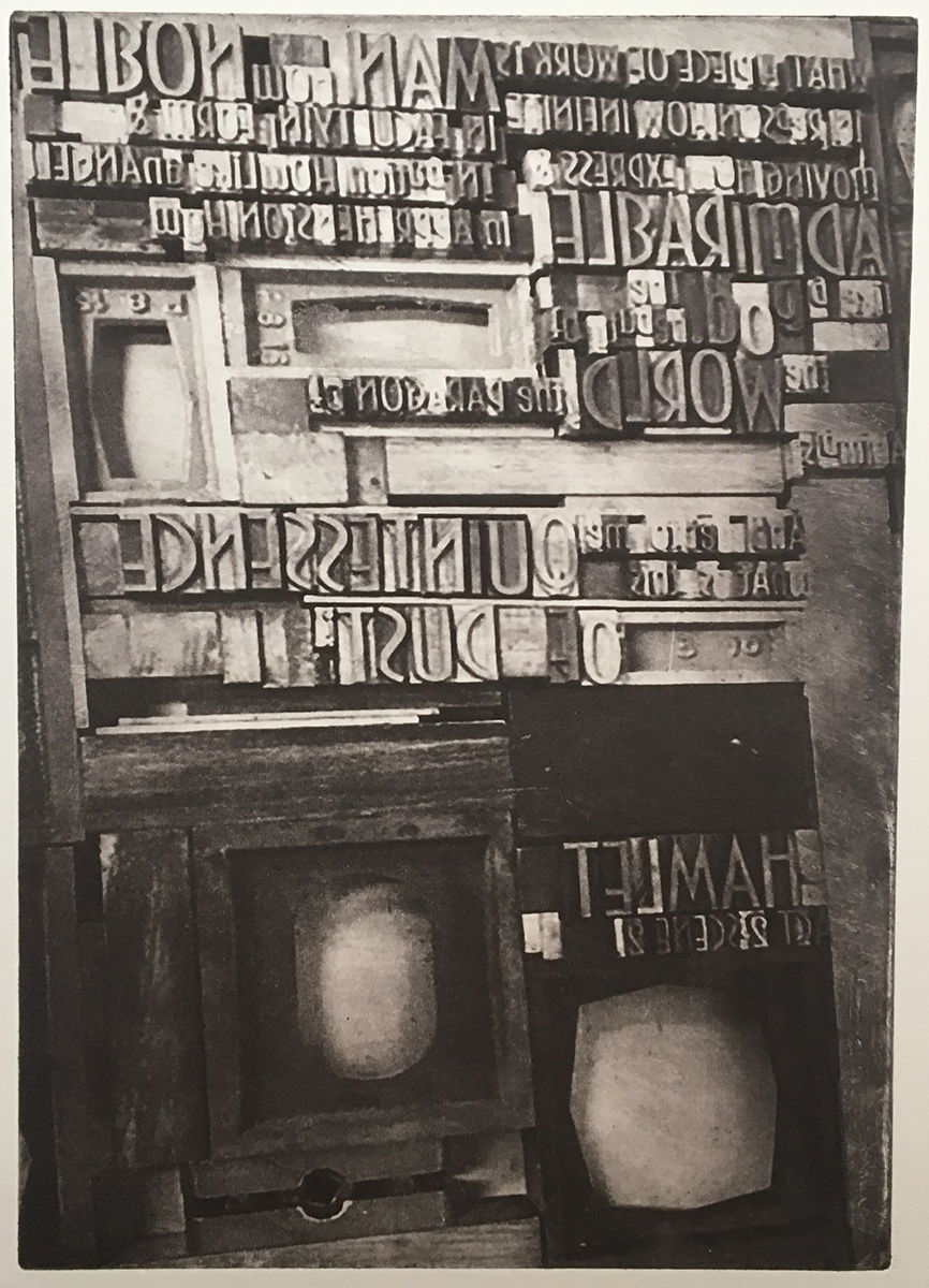 black and white print of varoius blocks with letter on them. It seems that the letters and words are backwards.