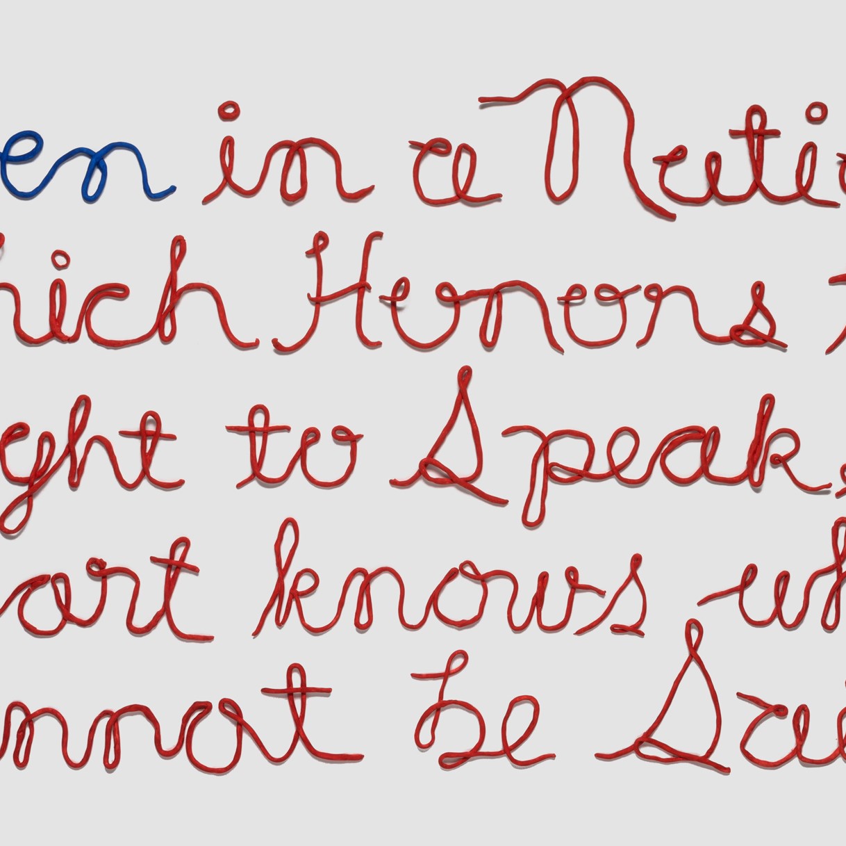  red and blue cursive lettering for a poem: Even in a Nation which Honors the Right to Speak, a Heart knows what Cannot be Said.