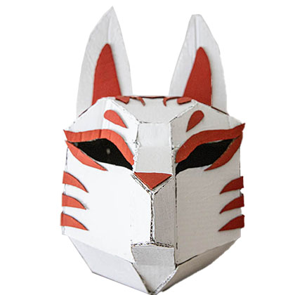 White cardboard sculpture of a wolf head, Details are portrayed using orange cardboard.