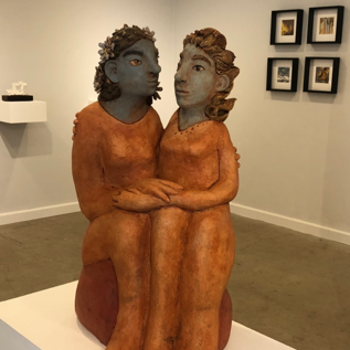 Flora and Fauna: Image description: Statue of two sitting women in embrace