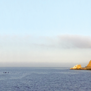 Return: Image description: photograph of blue sky and blue ocean