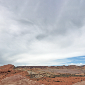 VF3698: Image description: Photograph of cloudy sky and brown ground