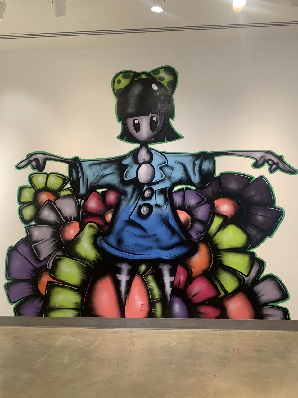 Temporary Flowers, An artwork of flowers surrounding a girl in the middle, spraypainted to the wall