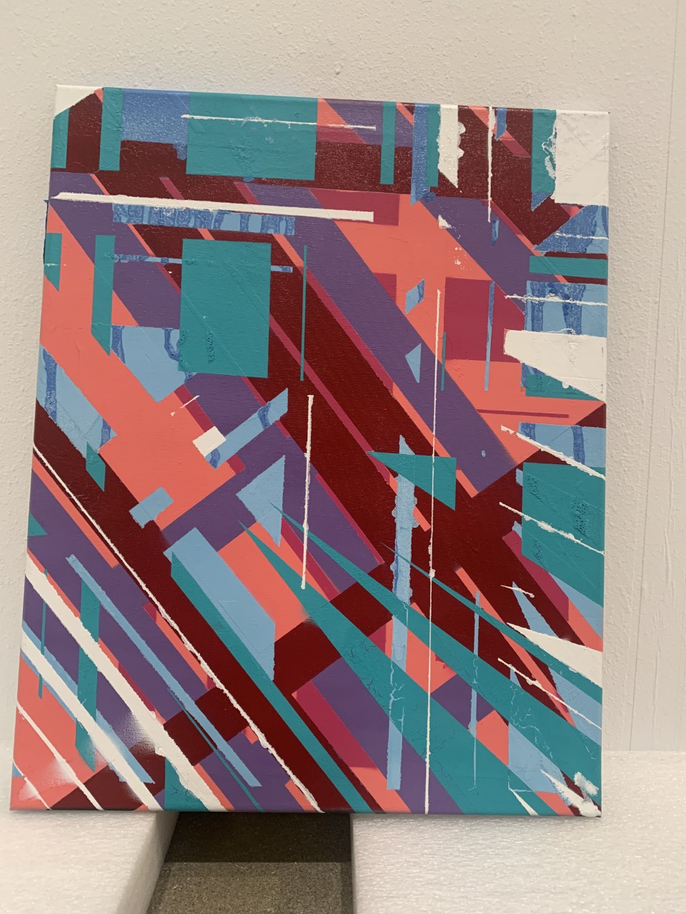 Lock Down Painting 2, image is a geometric artwork thats blue, pink, purple, and white