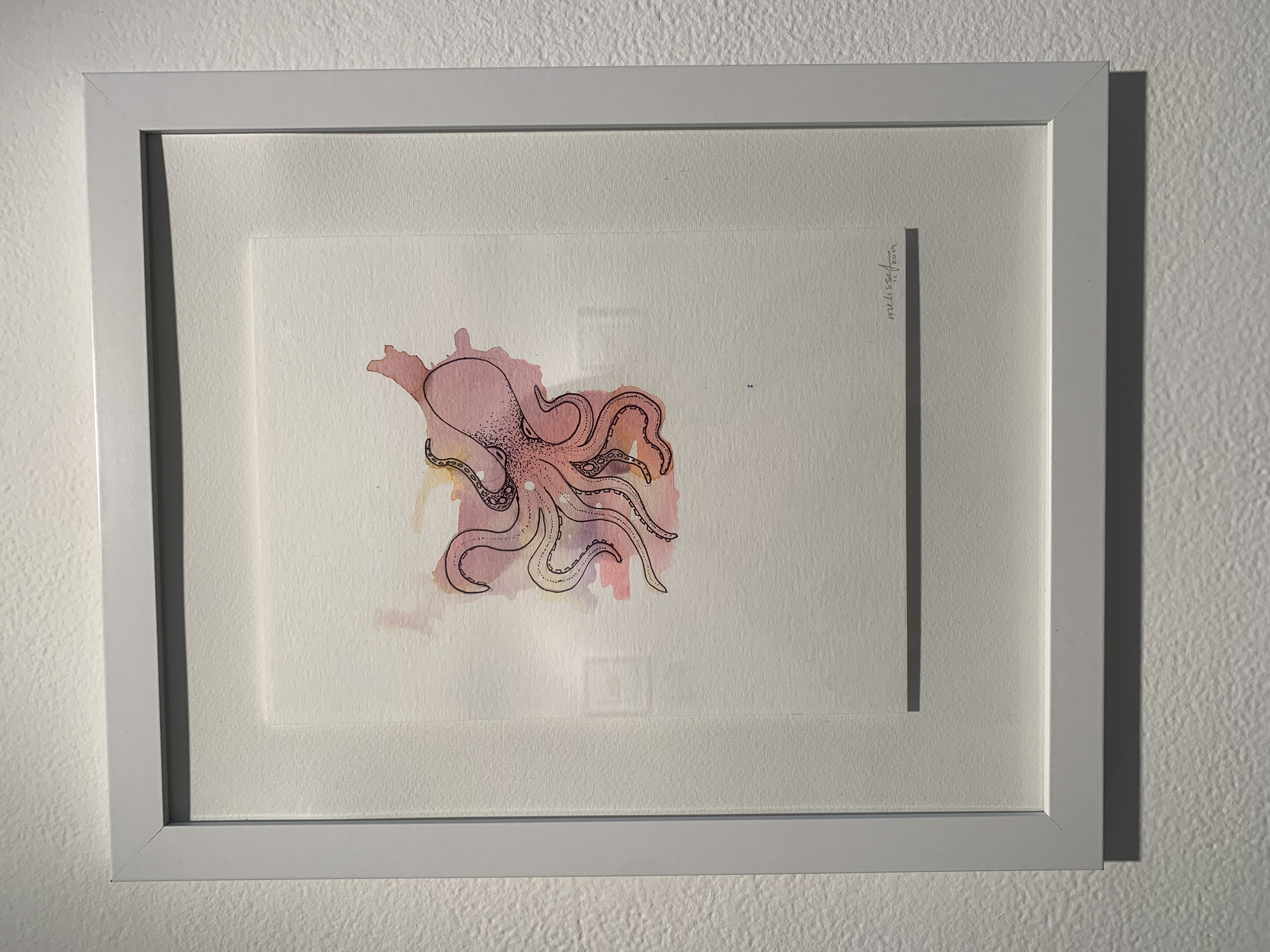 003: Image description: pink octopus on white background