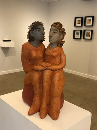 Flora and Fauna: Image description: Statue of two sitting women in embrace