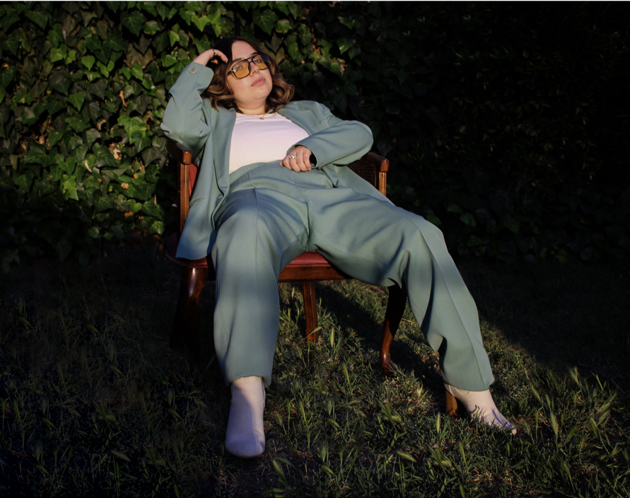 A photo of a person sitting on an orange chair