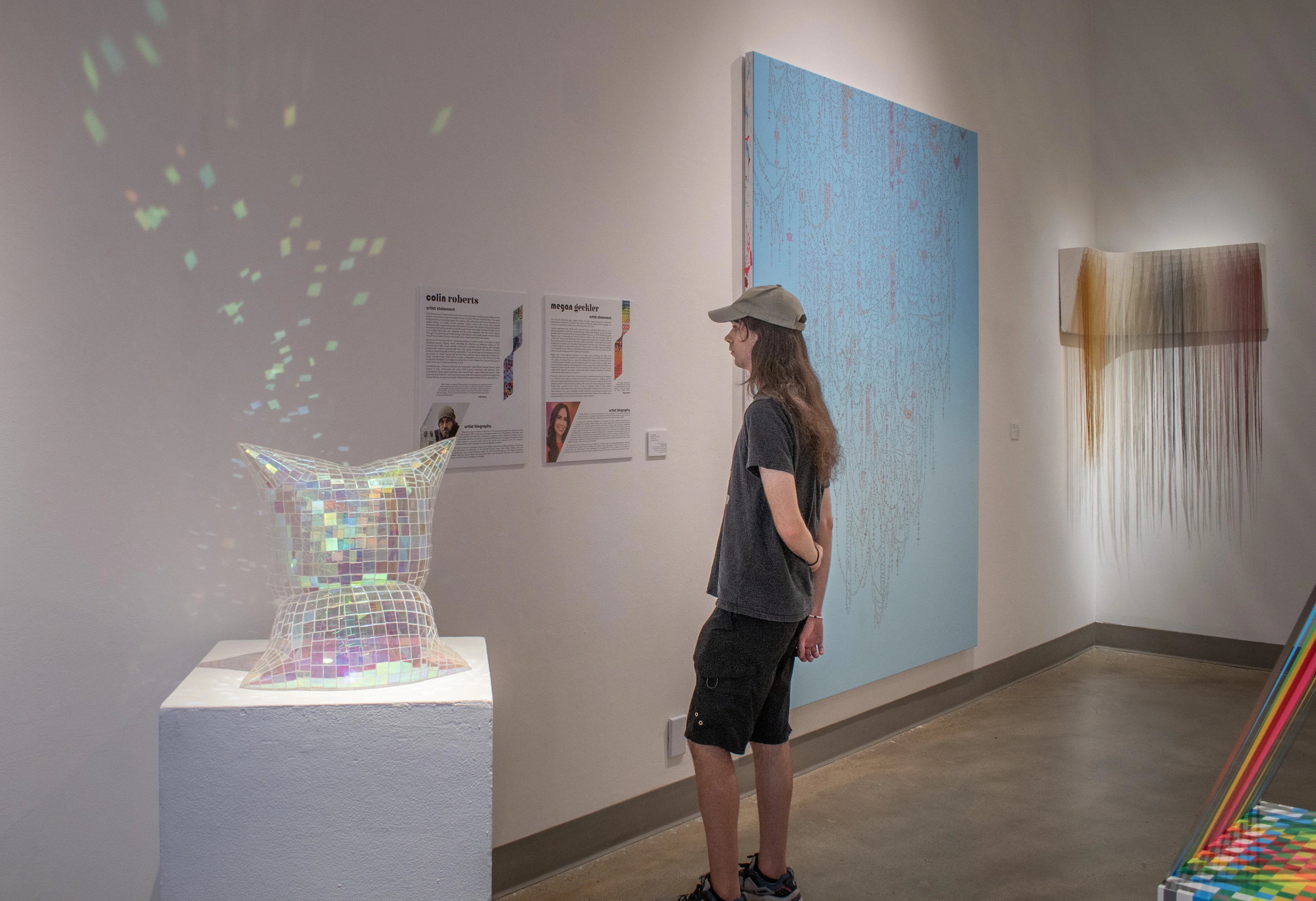 Reception photo for "Color & Quirk" featuring staff member Riley.