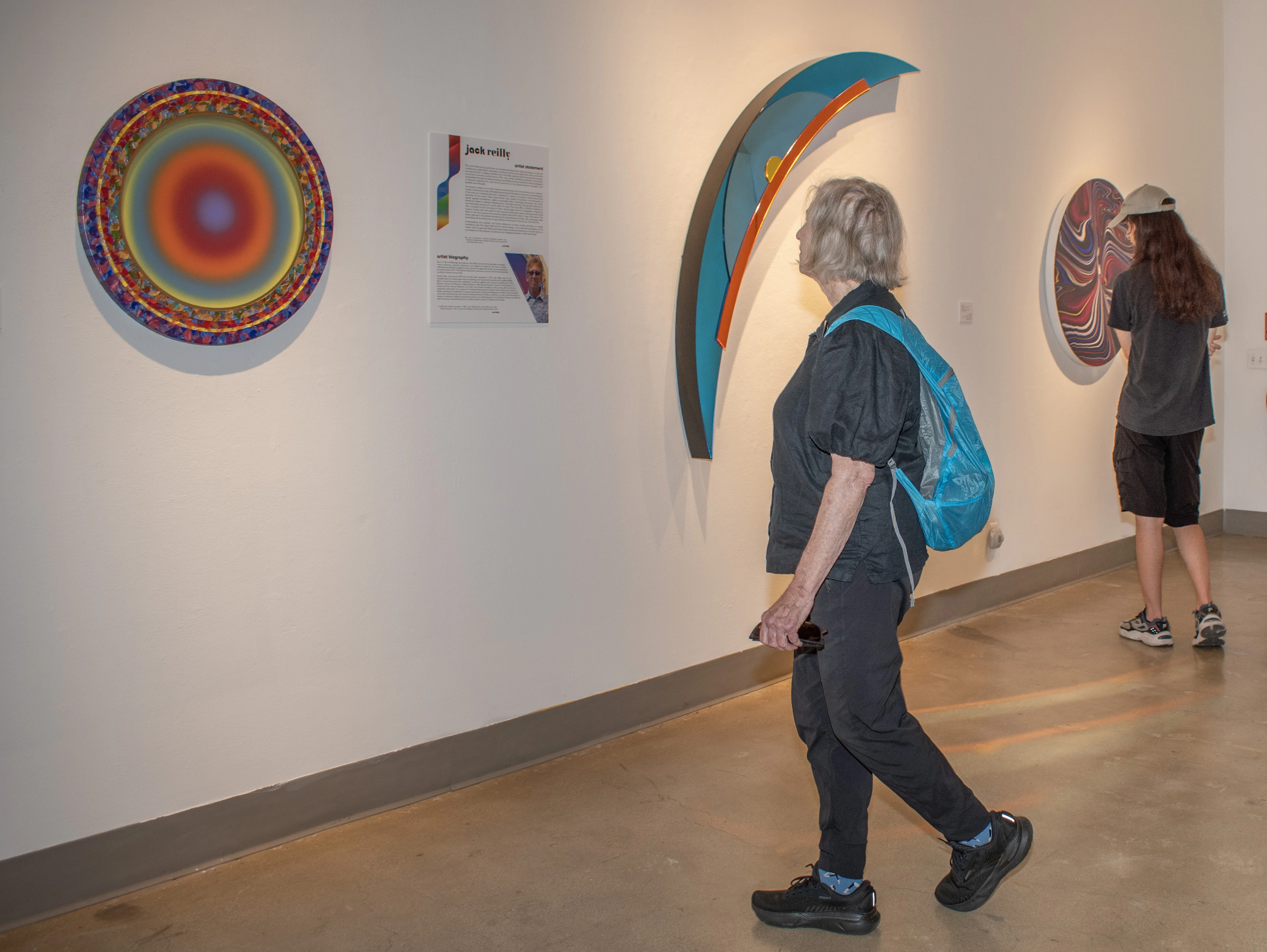 Guests observing artwork within the west gallery.