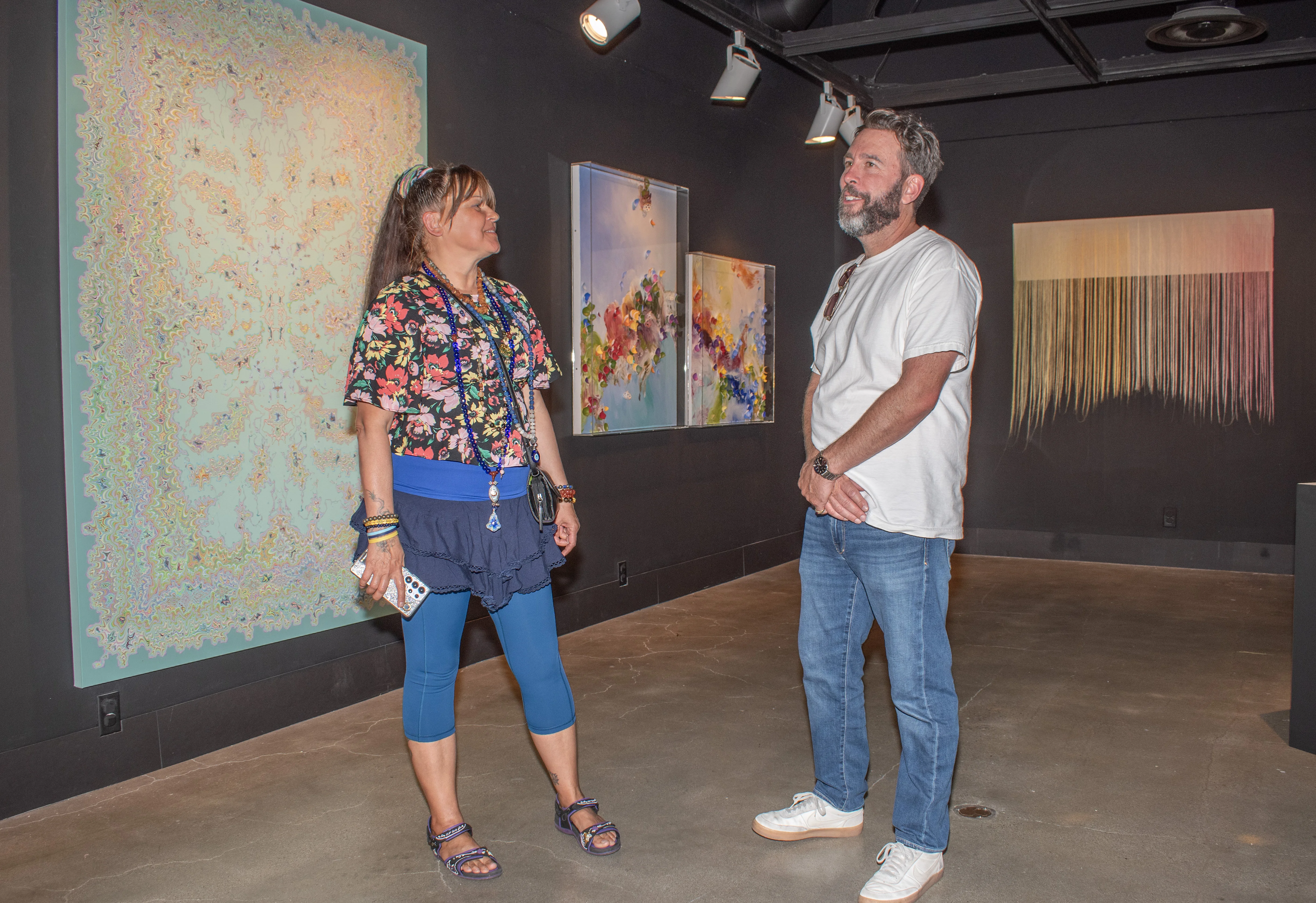Guests viewing artwork within the corridor of the gallery.