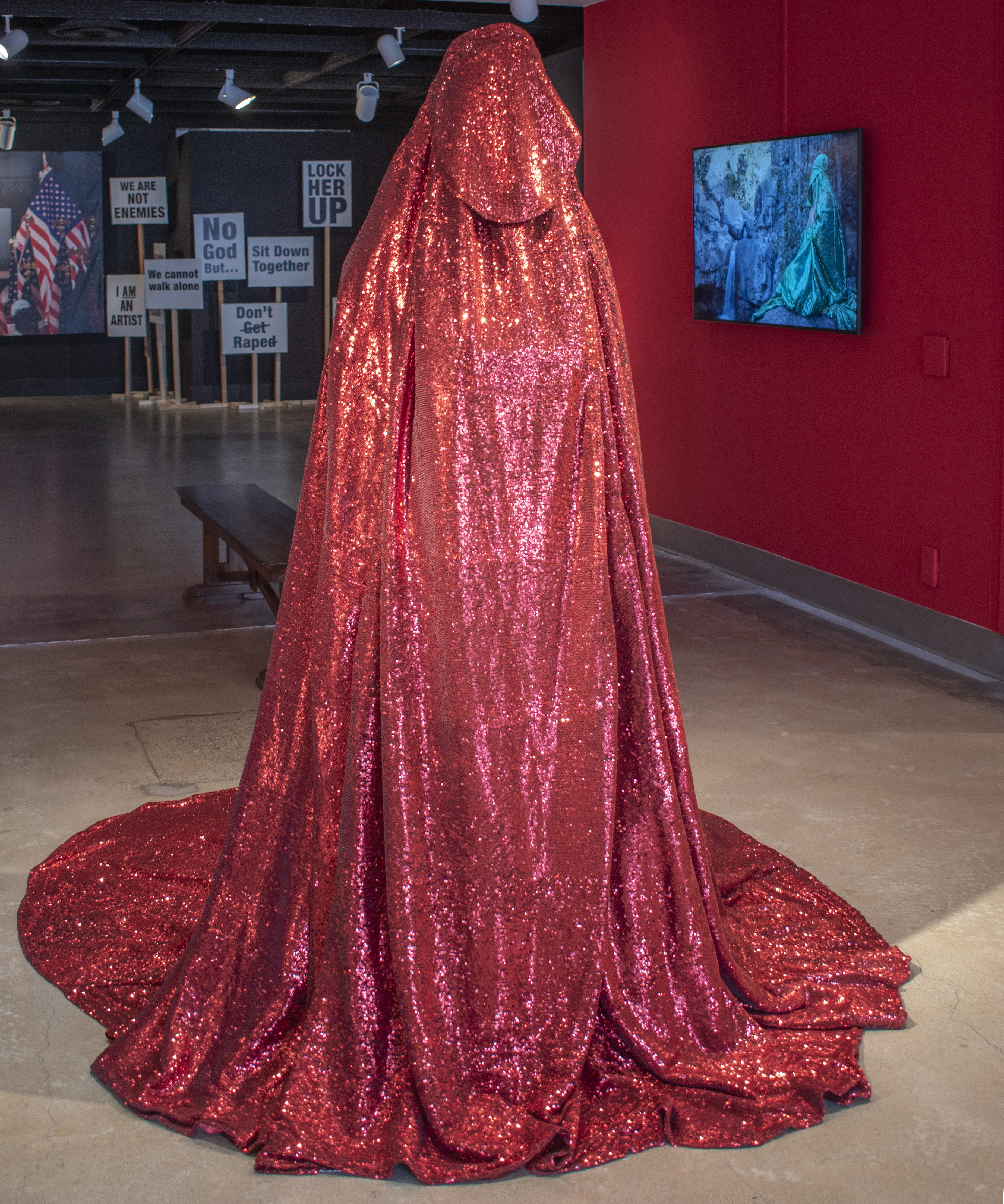 The Red Chador within the gallery corridor