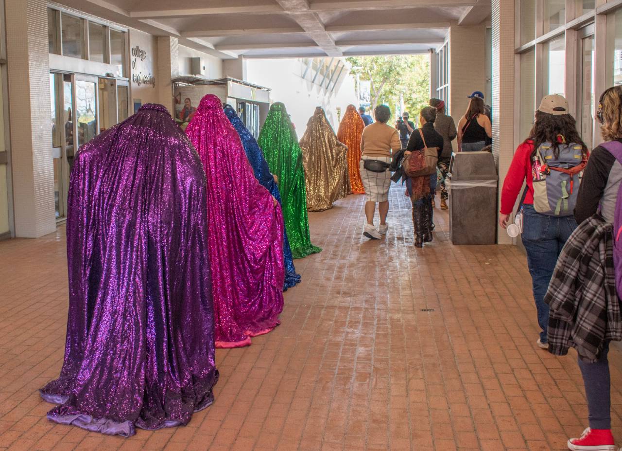 Rainbow Brigade walking through the College of Engineering.