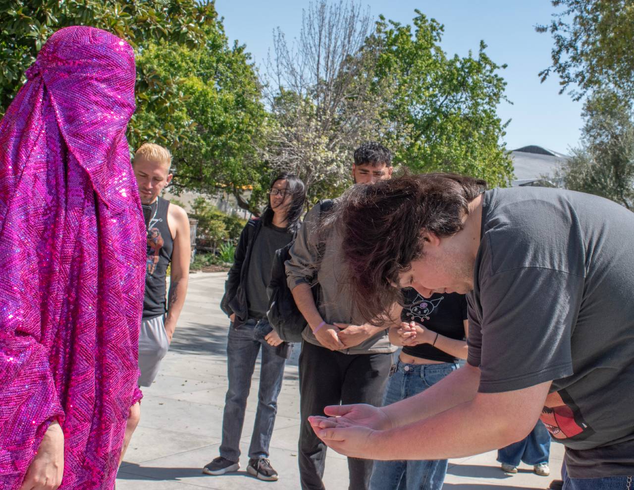 Student interacting with the Pink Chador.