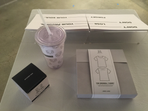 travel cup and box with shirt design on it 