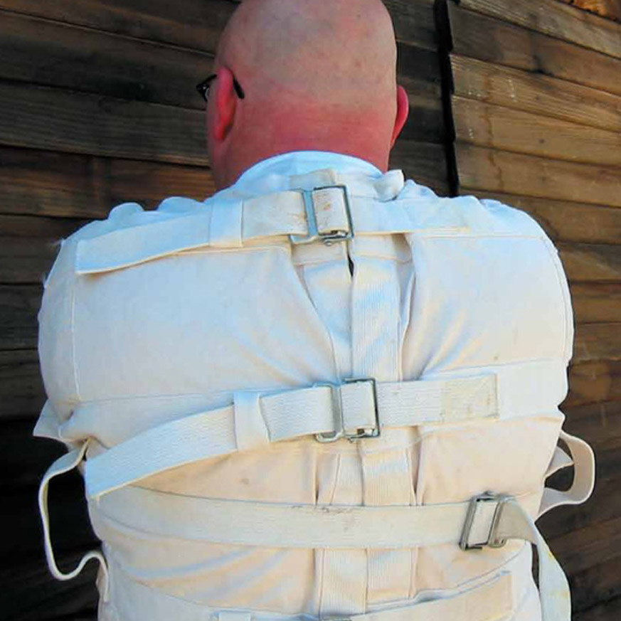 Image of the back of a man in a straight jacket 