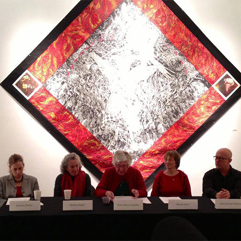 panel discussion with five distinguished guest. Patrick Merrill's “Seventh Seal" artwork in the background.
