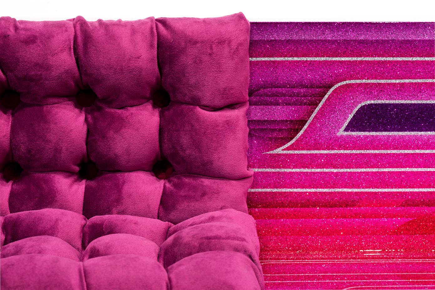 Dark Pink deep button tufting cushion, next to a multiline textile with different pink accents