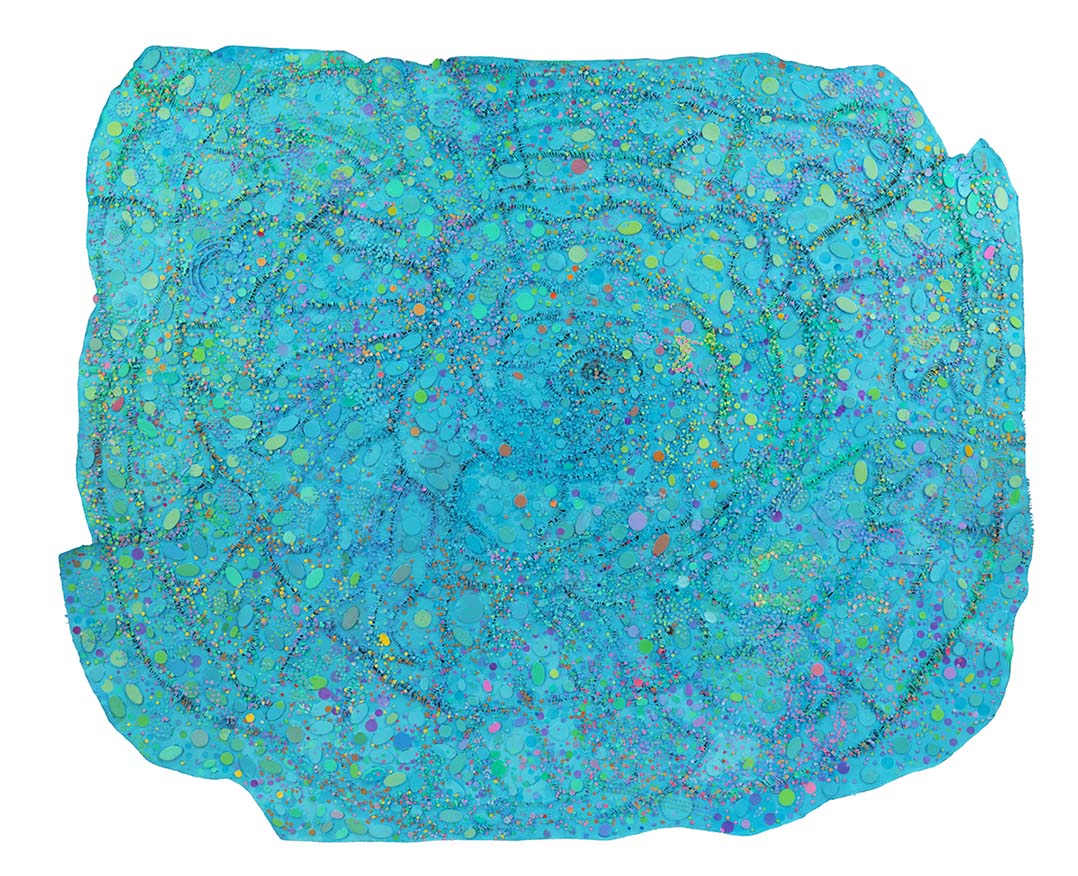 Image of blue organic-rectangle rug-like object with small colorful dots.