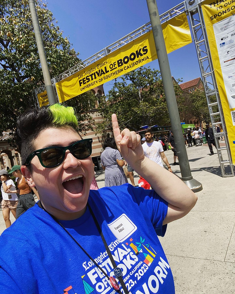 vanessa pointing at a sign