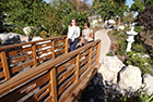 Two women crossing the Japanese Garden bridge