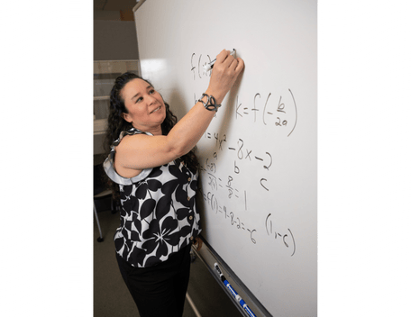 Denise Garretson writes out a math equation at the Learning Resource Center at Cal Poly Pomona 