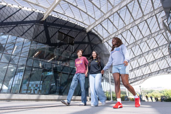 Students walking together at Student Services Building