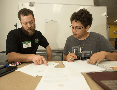 Jacob Fisher helps Isaiah Elferos with his calculus at The Learning Resource Center in the University Library at Cal Poly Pomona 