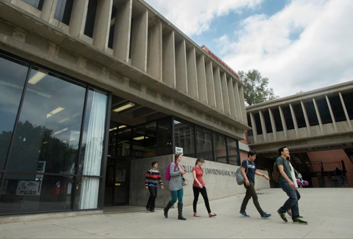 Students walking out of the college of env design building