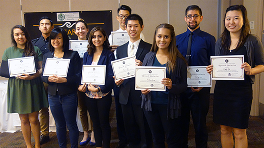 Group of students holding a certificate at recognition event
