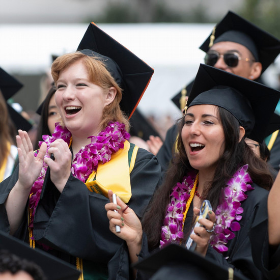 Graduate cheering at commencement