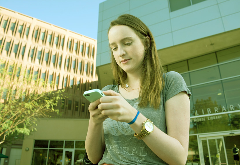Zoe holding phone