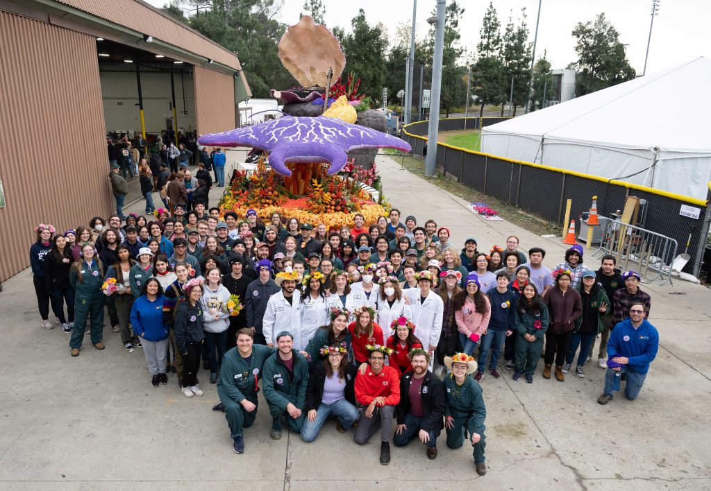 Students pose with the Rose Float judges.