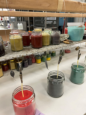 candles being made in jars