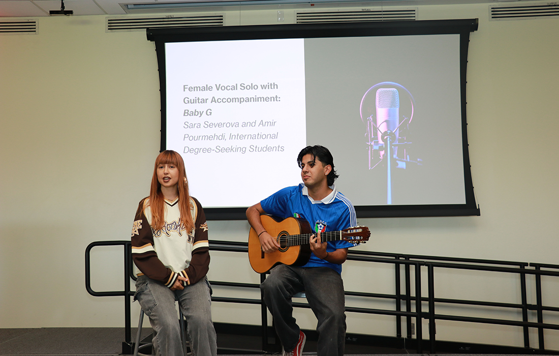 Sara Severova performs a vocal solo accompanied by Amir Pourmehdi on guitar.